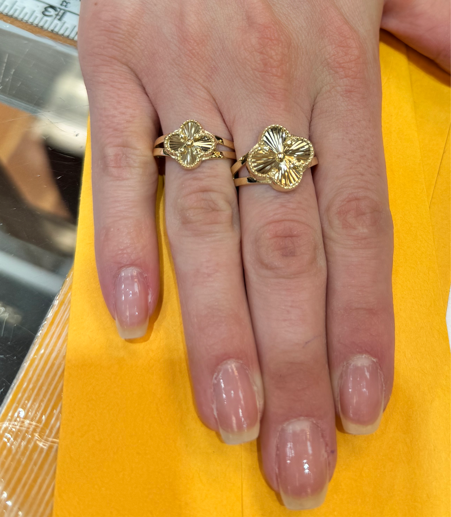 Women wearing a pair 14k gold ring 